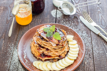 Stack of Paleo Pancakes with Banana and Honey for a Breakfast
