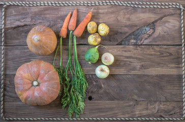 pumpkin, vegetables on a rustic wooden table