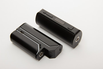 Dismantled parts of the electronic cigarette on a white backgrou