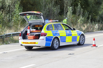 Police car at motorway accident or crime scene
