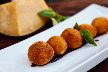 Naklejka na ściany i meble Cheese croquettes (Cheese breaded Camembert with berry sauce)