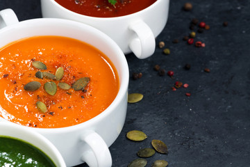 assortment of vegetable cream soup on and dark background