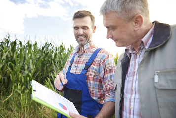 Walking on field and analyzing data © gpointstudio