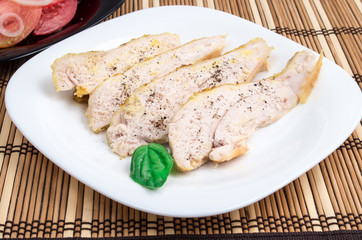 Baked chicken on a white plate