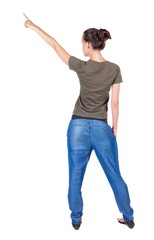 Back view of  pointing woman. beautiful brunette  girl in jeans.  Rear view people collection.  backside view of person.  Isolated over white background.