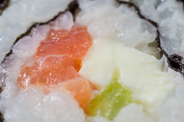 Japanese sushi made with rice, fish and seaweed with ginger and wasabi