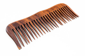 Fototapeta premium wooden hairbrush or comb with some dandruff