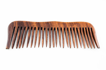 Fototapeta premium wooden hairbrush or comb with some dandruff