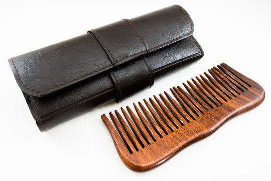 wooden hairbrush or comb with some dandruff