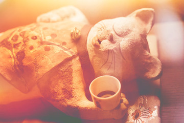 Japanese cat drunk sleeping doll classic light leak vintage color tone beautiful old style for postcard or background.