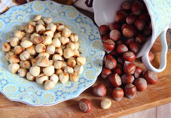 Roasted hazelnuts on a saucer..