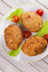 Scotch Eggs Served with Tomato Cherry and Salad on White Plate