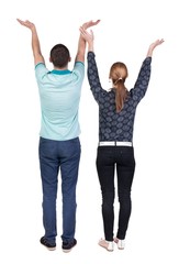 Back view couple  looking at wall and Holds  hand up. Rear view people. Isolated over white background. 