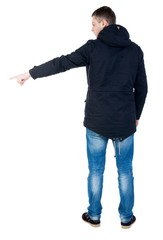 Back view of pointing man in winter jacket  looking up.   Standing young guy in parka. Rear view people collection.  backside view of person.  Isolated over white background.