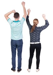 Fototapeta premium Back view of joyful couple celebrating victory hands up. Rear view people collection. backside view of person. Isolated over white background. 