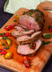 Beef Steak with Tomatoes, Thyme, Coriander and Garlic on Chopping Board.