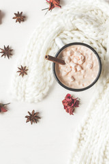 Fototapeta na wymiar Autumn. Hot chocolate, knitted blanket and dried rose flowers. Flat lay, top view