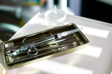 Dentist selecting his items.  equipment.