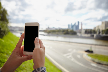 Girl taking photo with smart phone