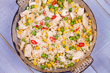 Chicken Breasts with Rice, Peas, Corn and Chili. View from above, top studio shot