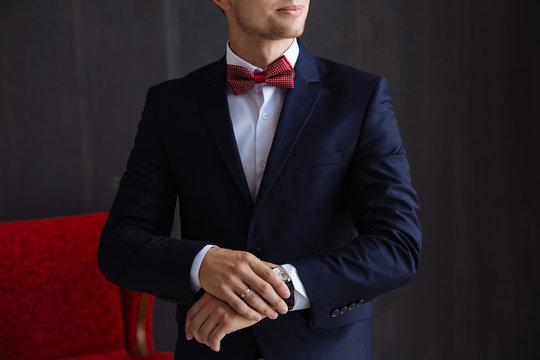 Man holding bow tie. Elegant gentleman clother.