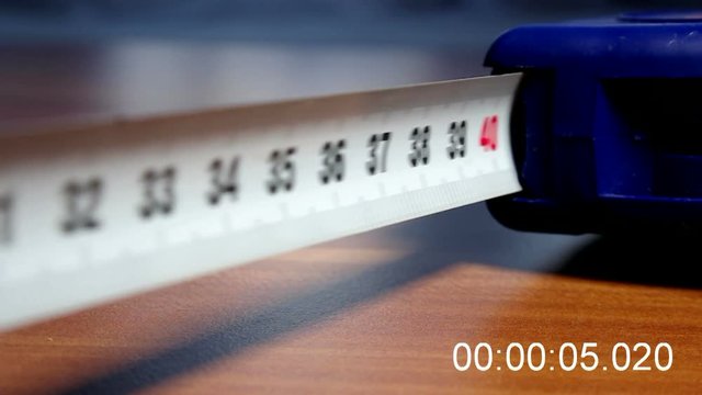 
Measuring construction tape measure with meter