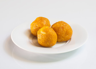 Indian Traditional Diwali sweets called Motichoor Ladoo,on white / Indian dessert