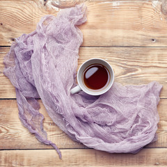 Obraz na płótnie Canvas Organic tea with colored cheesecloth on a wood table