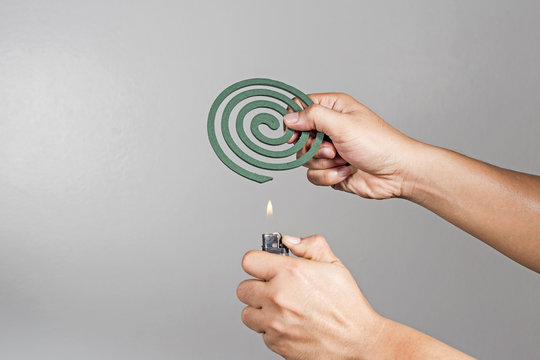 The gesture was a mosquito coil. To prevent mosquito in the room.