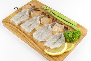 Raw shrimp on wood