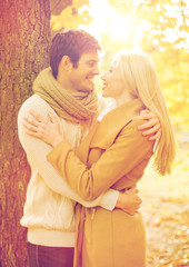 Fototapeta premium romantic couple kissing in the autumn park