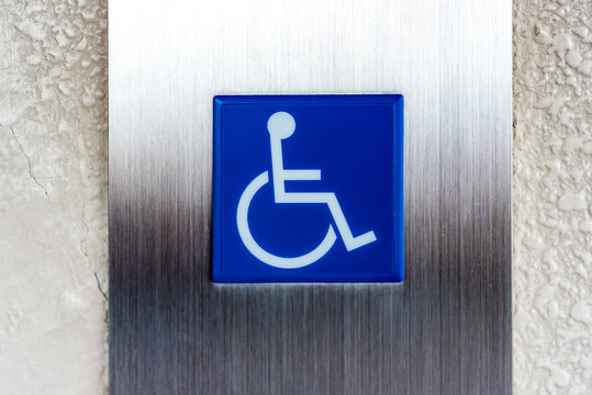disabled person sign on metal plate