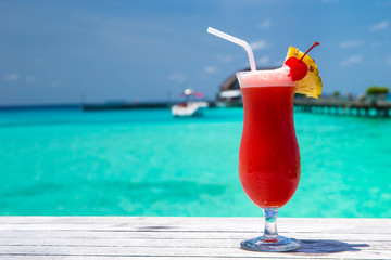cocktail with blur beach on background
