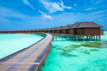 beach with water bungalows at Maldives