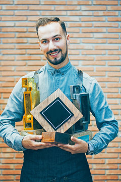 Smiling bartender with prizes