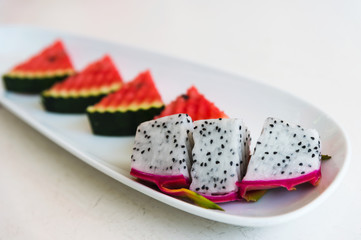 sliced dragon fruit and watermelon on plate