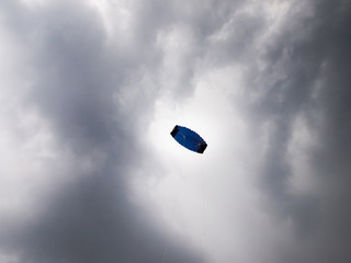 kite in the sky with storm clouds