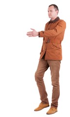 Fototapeta premium handshake in walking man in brown jacket and jeans. Rear view people collection. backside view of person. Isolated over white background.