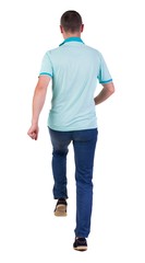 Back view of running man in blue polo. Walking guy in motion. Rear view people collection. Backside view of person. Isolated over white background.