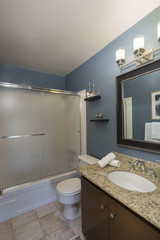Fototapeta na wymiar Blue bathroom in a modern apartment