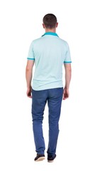 Fototapeta premium Back view of going handsome man in jeans and a shirt. walking young guy . Rear view people collection. backside view of person. Isolated over white background.
