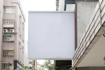 Large blank billboard on a street wall, banners with room to add your own text
