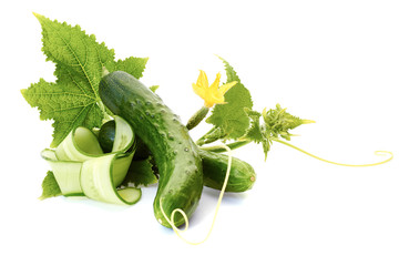 Cucumbers with leaves on white.