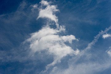 Fototapeta na wymiar Bright blue sky with fluffy white clouds