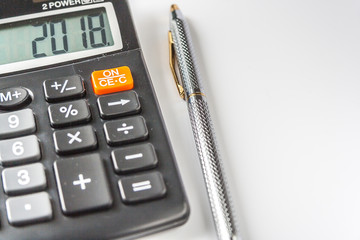 2018 Written On Electronic Calculator And Ballpoint Pen