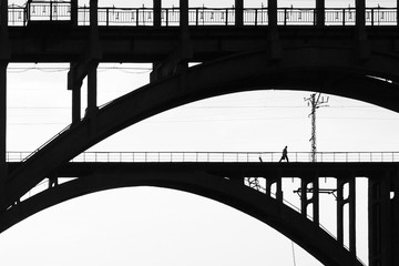 black-and-white photograph of the bridge and people on it
