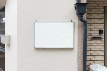 Large blank billboard on a street wall, banners with room to add your own text