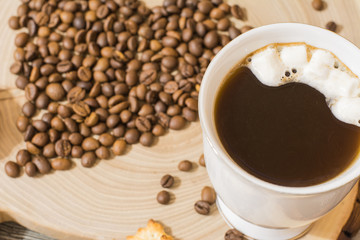 coffee beans coffee mug on a wooden cutting