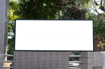 Large blank billboard on a street wall, banners with room to add your own text