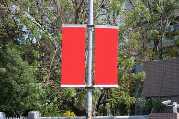 Large blank billboard on a street wall, banners with room to add your own text